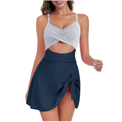 Women's black and white swimsuit dress with a criss-cross white top, midriff cutout, and a black skirted bottom with a side tie. - Image 2