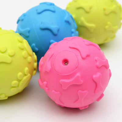 Five colorful TPR rubber pet toy balls in blue, pink, and yellow, with embossed paw print and bone patterns. - Image 11