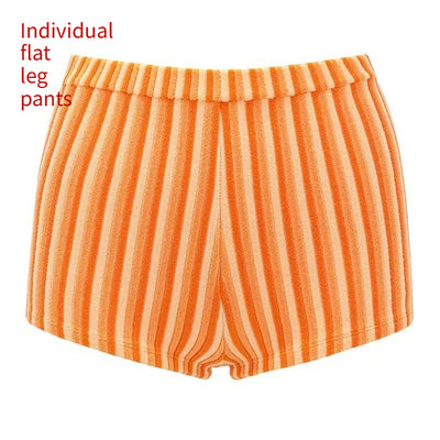 Orange and light orange striped bikini bottom with a ribbed texture and elastic waistband, ideal for beach vacations. - Image 10