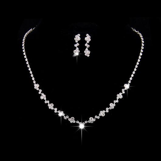 Simple rhinestone bridal necklace and matching drop earrings set, perfect for a wedding or formal occasion.