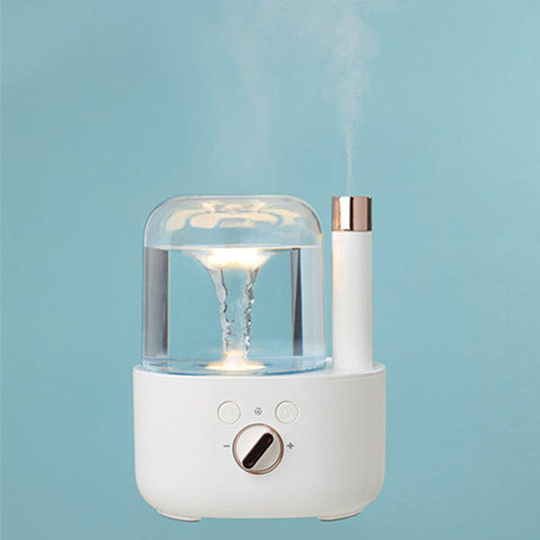 White and clear humidifier with a visible water vortex, emitting mist, and featuring a rose gold accent. - Image 6
