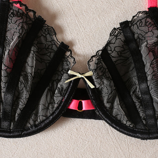 Black lace bra and thong set with hot pink harness straps, gold-tone rings, and a matching hot pink choker. - Image 3