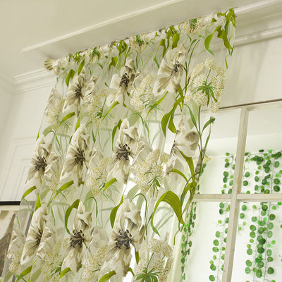 White sheer curtains with a green and beige floral pattern, hanging on a rod in a bright room. - Image 3