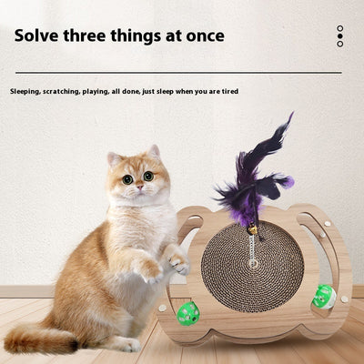 Multi-level cat scratcher with a round corrugated cardboard surface, a wooden track with a green ball, and a pink feather wand with a bell. - Image 3