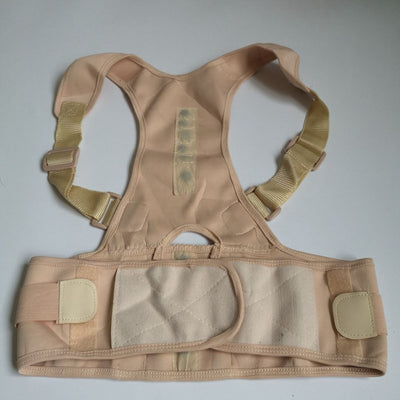 Beige magnetic posture correction belt worn on a woman's back over a black top, showing shoulder and waist support. - Image 9