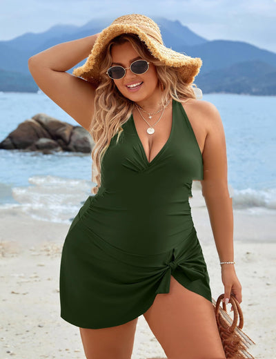 Plus size woman wearing a black one-piece skirted swimsuit with a halter neckline and side tie knot detail. - Image 11