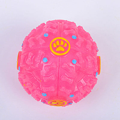 Blue rubber dog toy ball with bone-shaped nubs, red dots, and yellow paw print accents, designed for treats. - Image 5