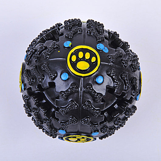Blue rubber dog toy ball with bone-shaped nubs, red dots, and yellow paw print accents, designed for treats. - Image 3