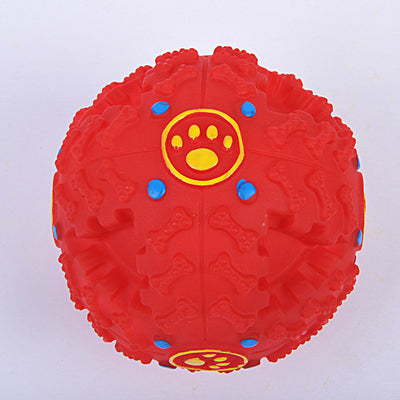 Blue rubber dog toy ball with bone-shaped nubs, red dots, and yellow paw print accents, designed for treats. - Image 6