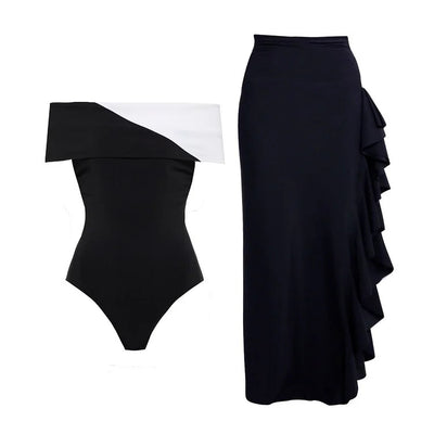 Black one-piece swimsuit with a deep V-neckline and white horizontal stitching detail across the plunge. - Image 32