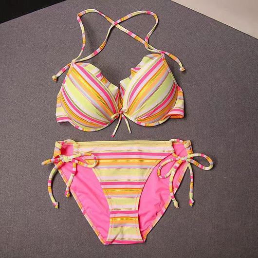 Colorful striped lace-up bikini swimsuit with a ruffled halter top and matching tie-side bottoms.