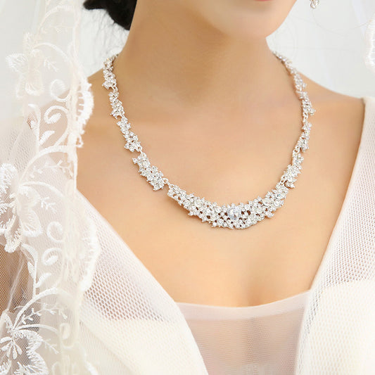 Silver-toned rhinestone necklace and matching dangle earrings set, featuring a sparkling floral cluster design. - Image 2