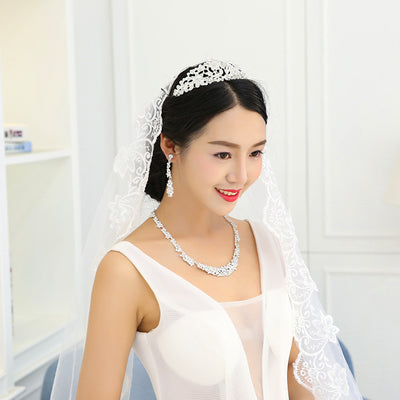 Silver-toned rhinestone necklace and matching dangle earrings set, featuring a sparkling floral cluster design. - Image 4
