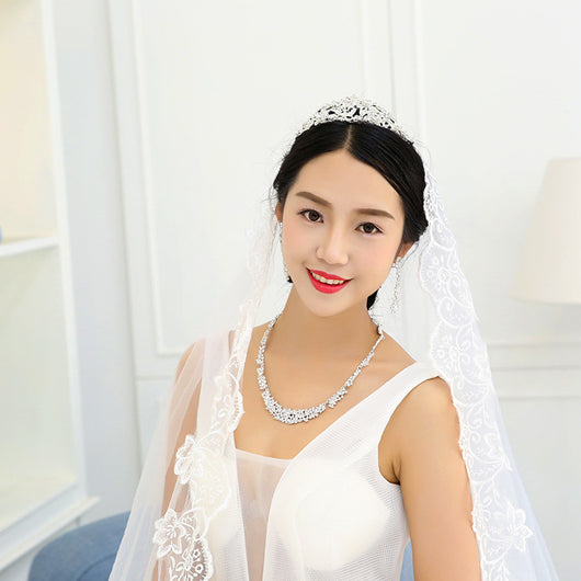 Silver-toned rhinestone necklace and matching dangle earrings set, featuring a sparkling floral cluster design. - Image 3