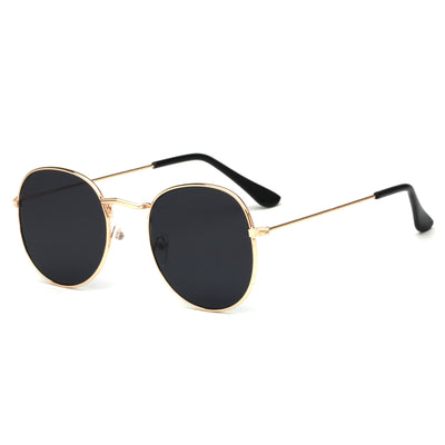 Round metallic sunglasses with iridescent green and gold lenses and a gold-colored metal frame. - Image 28