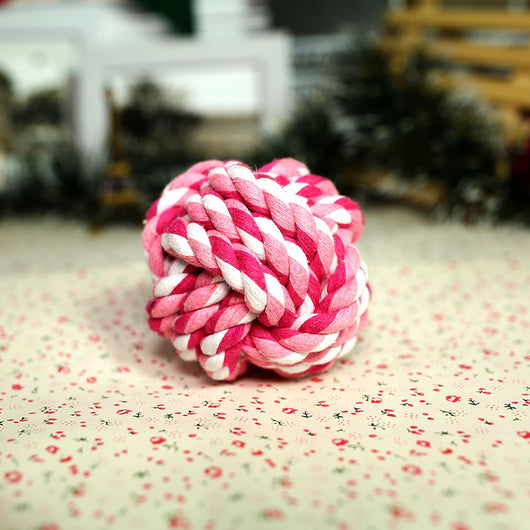 Pink and white braided cotton rope ball pet toy for dogs, designed for chewing and play. - Image 8