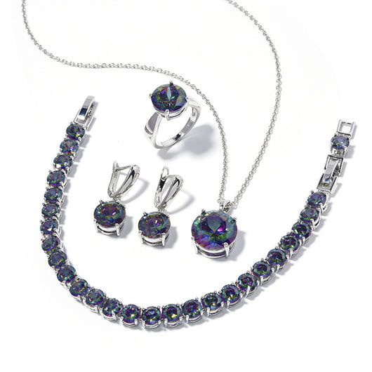 Four-piece jewelry set with silver-toned metal and round deep pink gemstones, including a necklace, bracelet, ring, and earrings. - Image 4