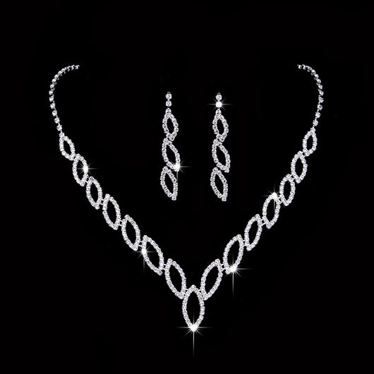 Sparkling silver-tone necklace and dangle earrings set with marquise-shaped rhinestone links for weddings or formal events.