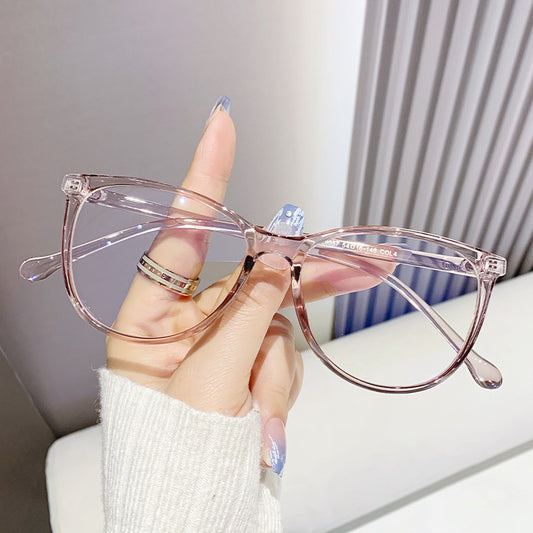 Black full-frame round anti-blue light glasses held by a hand with a gold ring and light blue gradient nails. - Image 2