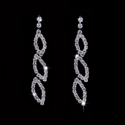 Sparkling silver-toned necklace and matching dangle earrings set with marquise-shaped rhinestone links. - Image 2