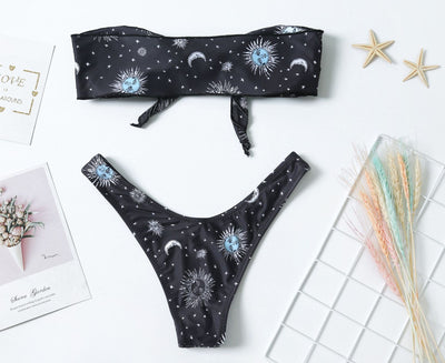 Black celestial print bikini set with a bandeau tie-front top and high-cut bottoms, featuring sun, moon, and star patterns. - Image 4