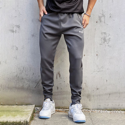 Pantalones de Chándal con Bolsillos de Cierre y Tela Elástica - Image 5