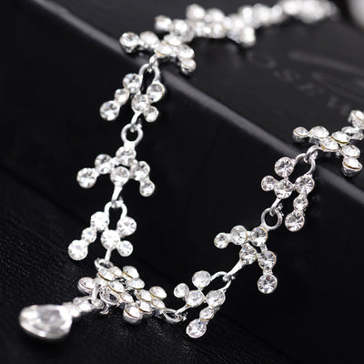 Silver-tone bridal necklace and drop earrings set with clear rhinestones and teardrop faux diamonds. - Image 5