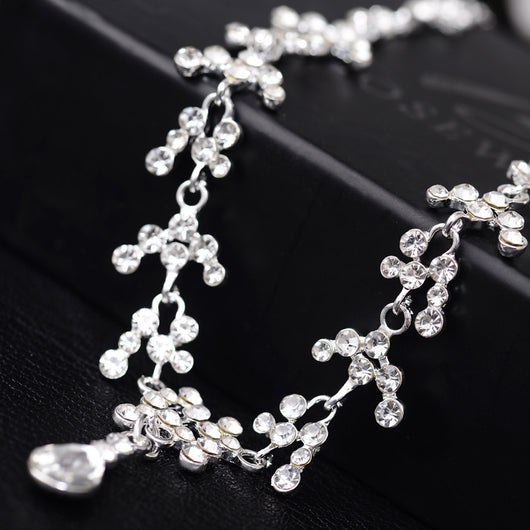 Silver-tone bridal necklace and drop earrings set with clear rhinestones and teardrop faux diamonds. - Image 5