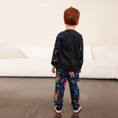 Family Christmas pajamas with a cartoon reindeer wearing a Santa hat and red scarf on a black top, and dark blue pants with a repeating reindeer and holly patte - Image 12
