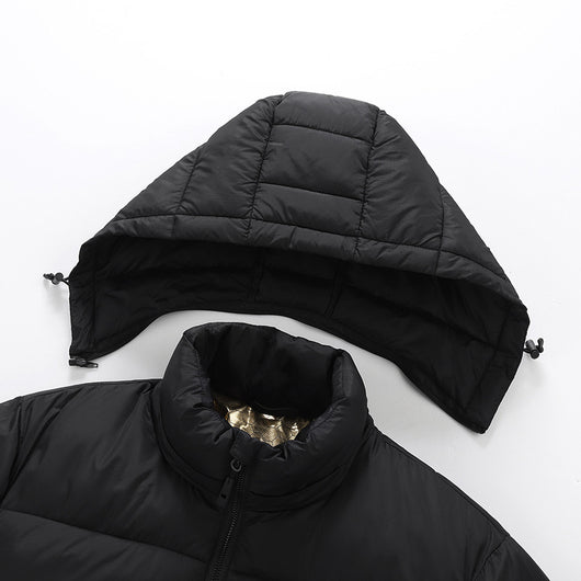 Man and woman modeling black smart heating puffer jackets with hoods, zippered pockets, and horizontal quilting. - Image 4