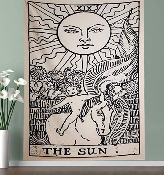 Black and white 'The Sun' tarot card tapestry featuring a sun with a face, a child on a horse, and sunflowers.