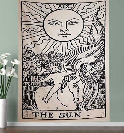 Black and white 'The Sun' tarot card tapestry featuring a sun with a face, a child on a horse, and sunflowers.