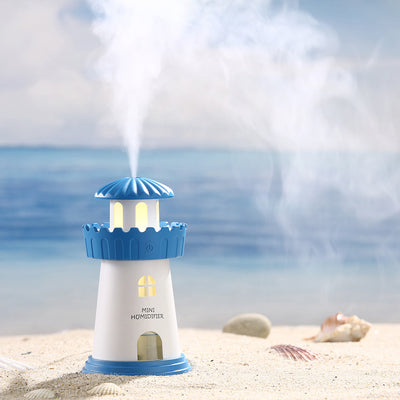 Blue and white lighthouse-shaped mini humidifier with a power button, decorative windows, and a door. - Image 2