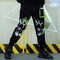 Pantalones Holgados con Detalles de Costura y Cordones Decorativos