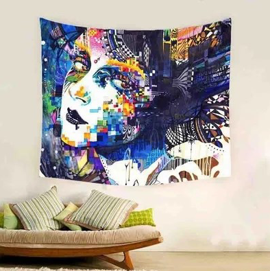 Colorful abstract geometric tapestry featuring a woman's face, hanging on a light wall above a sofa with pillows. - Image 2