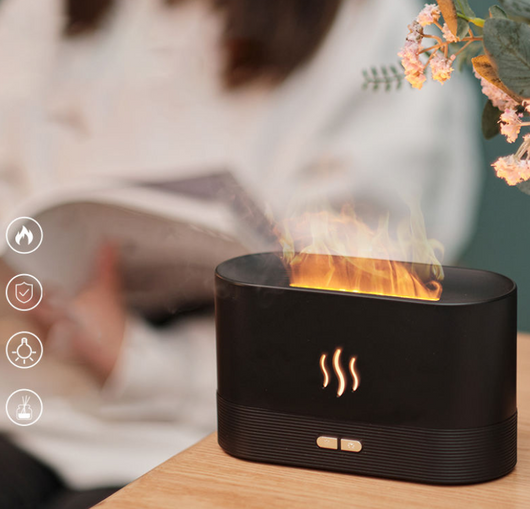 Black aroma diffuser with purple flame light effect and mist, featuring control buttons and a flame icon. - Image 17