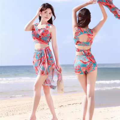 Women's light blue tropical leaf print three-piece swimsuit with short sleeve bikini top, bottoms, and sarong skirt. - Image 17