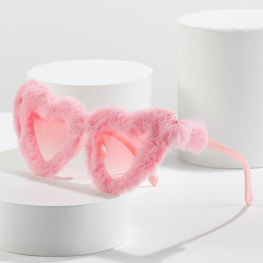 Pink plush heart-shaped sunglasses with light pink tinted lenses and matching pink plastic temples. - Image 2