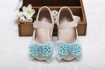 Beige girls' princess shoes with pearl and rhinestone bows, featuring a flat heel and a convenient Velcro strap. - Image 14