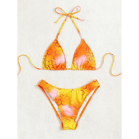 Yellow and orange floral string bikini swimsuit for women, featuring a triangle top and high-cut bottoms by a pool. - Image 3