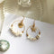 Wild Metal Five-Pointed Star Earrings with Seashell