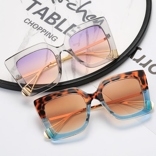 Women's black square frame sunglasses with blue gradient lenses and gold metal temples featuring a pearl accent. - Image 3