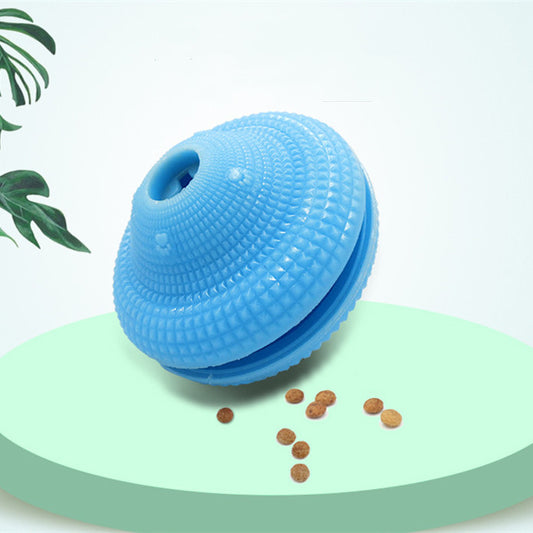 Blue TPR pet toy ball with textured surface, designed for food dispensing and molar training, with kibble scattered around.