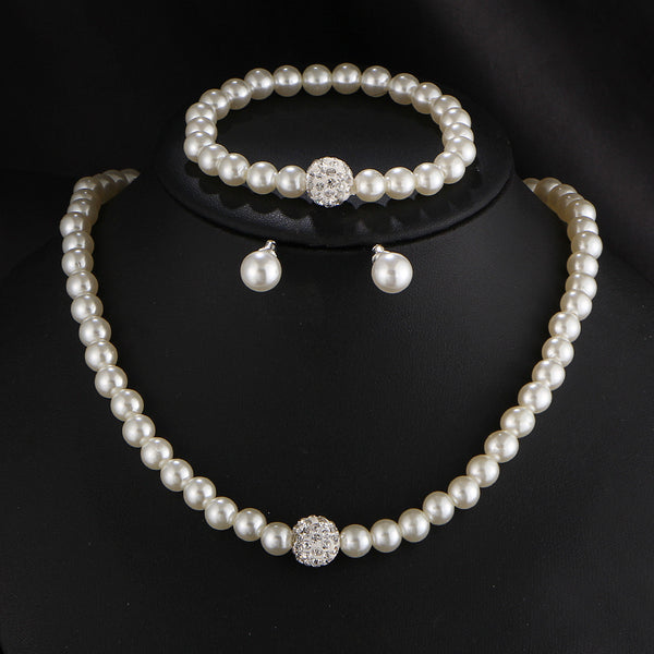 White pearl necklace, bracelet, and stud earrings set with pave crystal ball accents, displayed on a black stand. - Image 4