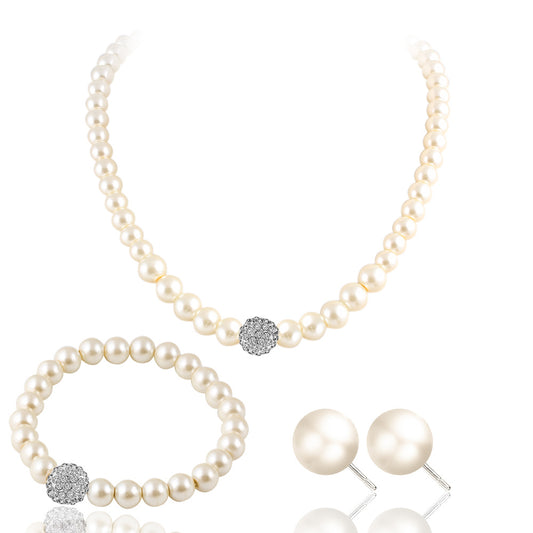 White pearl necklace, bracelet, and stud earrings set with pave crystal ball accents, displayed on a black stand.