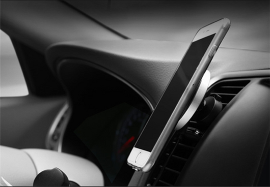 Silver and black car magnetic wireless charger with a blue indicator light, mounted on a car's air vent. - Image 3