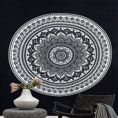 Black and white mandala tapestry with intricate geometric patterns hanging above a bed in a bedroom. - Image 3
