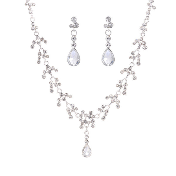 Silver-tone bridal necklace and drop earrings set with clear rhinestones and teardrop faux diamonds. - Image 6