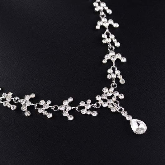 Silver-tone bridal necklace and drop earrings set with clear rhinestones and teardrop faux diamonds. - Image 3