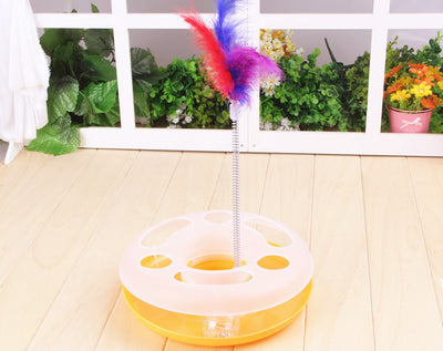 Interactive cat toy with a yellow and white circular ball track base and a spring-mounted feather wand. - Image 7